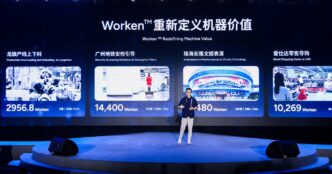 AgiBot co-founder Peng Zhihui on a stage in front of a large screen titled Worken Redefining Machine Value, showing four robot deployment panels with Worken scores
