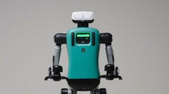 Agility Robotics Digit humanoid robot with a teal torso and white head unit, shown from the waist up against a plain grey studio background
