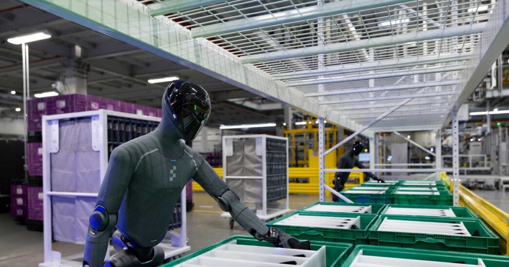 Figure 03 (F.03) humanoid robot at BMW Group Plant Spartanburg reaching into a parts bin
