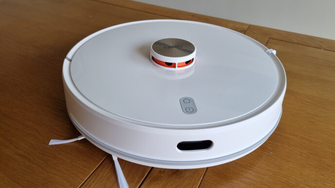 Top-down view of a white Xiaomi Lydsto robot vacuum and mop with a raised lidar turret, resting on a wooden floor