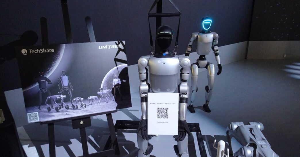 Unitree G1 and H1 humanoid robots and a Go2 quadruped on display at a TechShare booth at Japan Mobility Show 2025