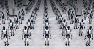 Rows of silver-and-black UBTech Walker S2 humanoid robots standing in formation on a grey concrete floor in a large hall