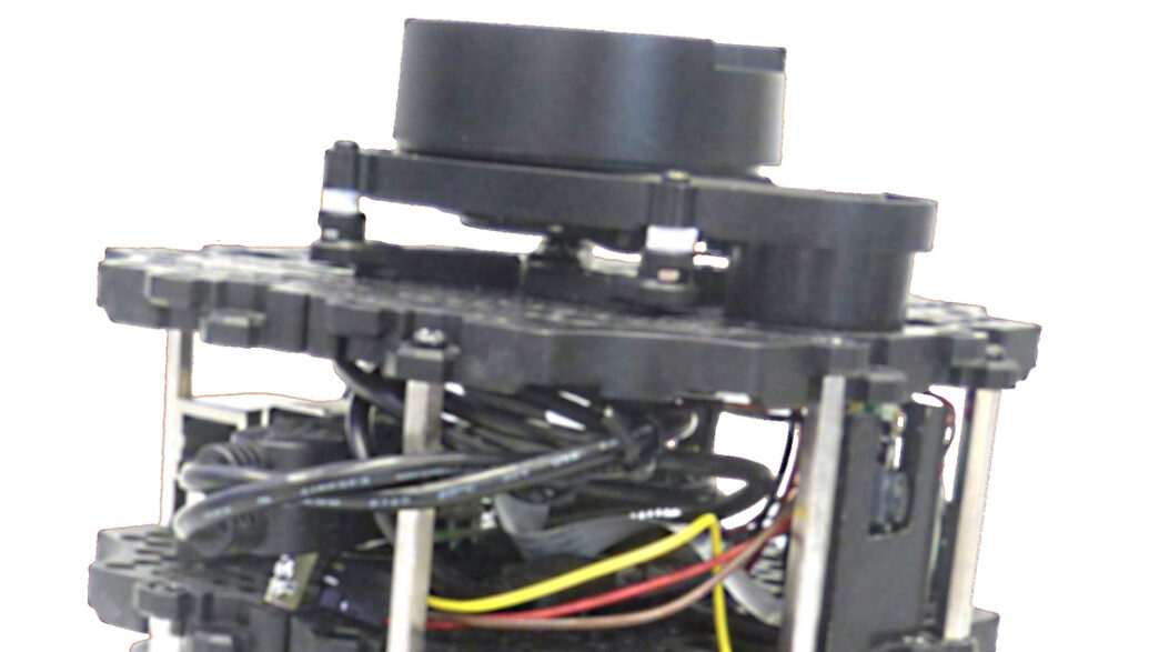 Top tiers of a TurtleBot3 Burger, a small tiered mobile research robot with a lidar scanner on top, against a white background