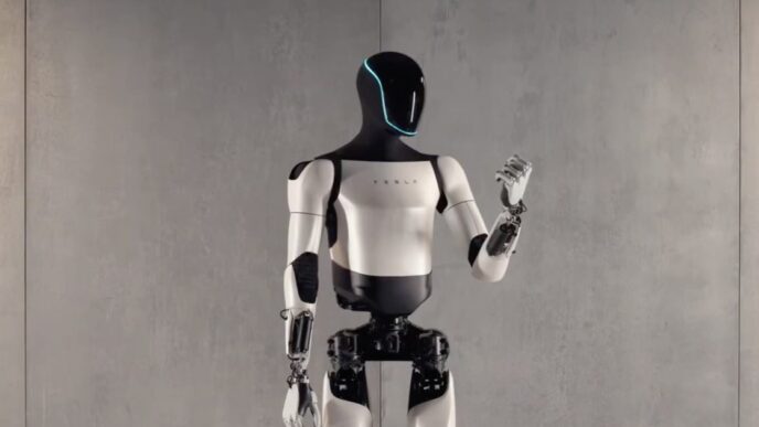 Tesla Optimus Gen 2 humanoid robot standing in a product studio pose